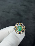 Oval Emerald & Unheated Blue Sapphire Diamond Cluster Ring